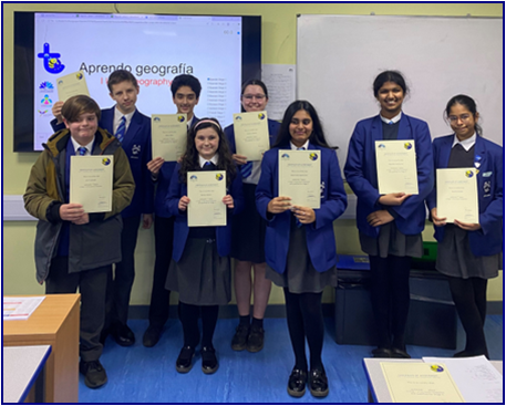 Year 7 Students holding Certificates at the front of the class