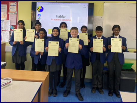 Year 7 students holding Spanish Spelling Bee certificates 